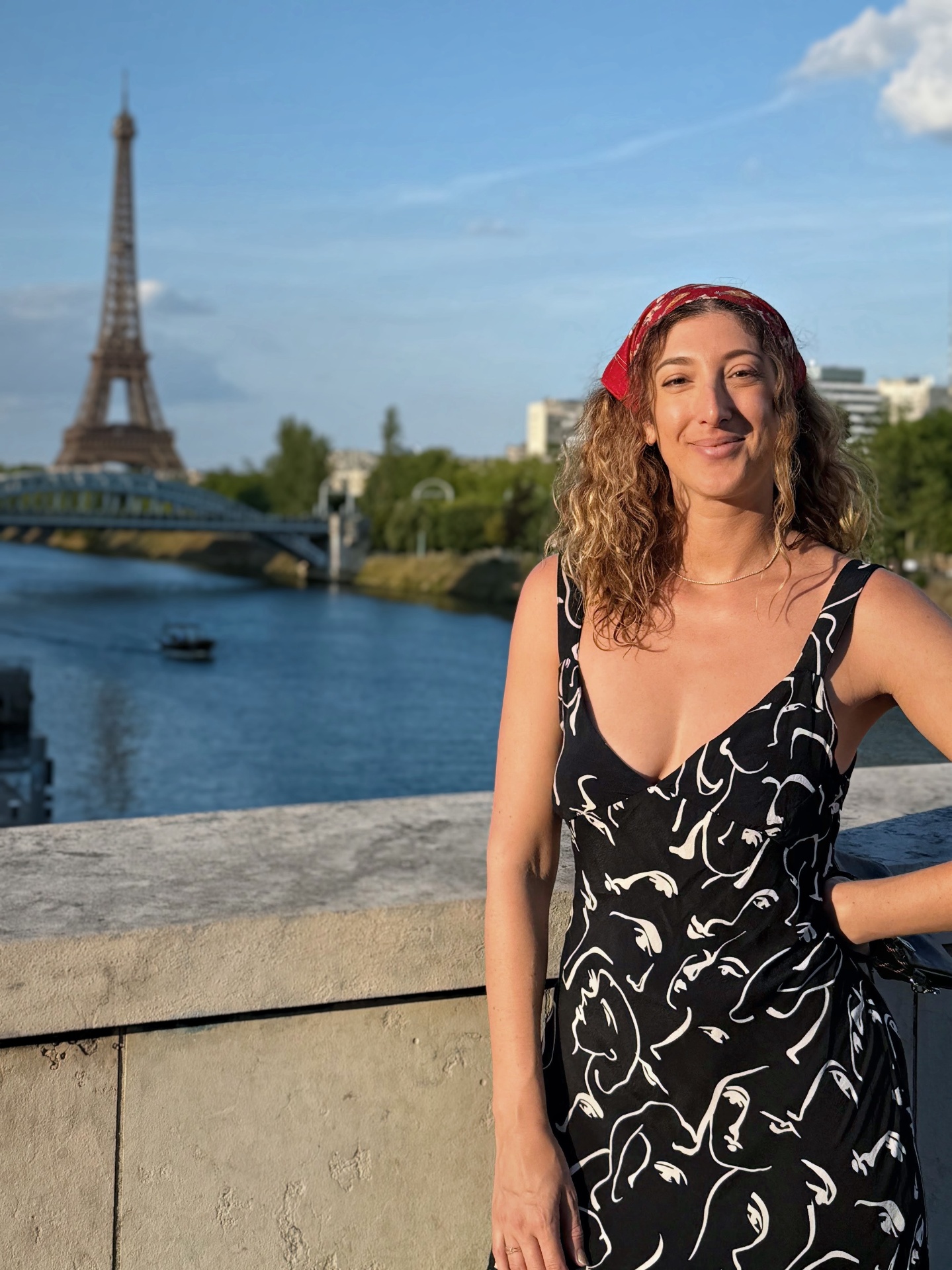 Stephanie Fuller in Paris with the Eiffel Tower and Seine in the background